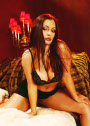 Aria Giovanni's bra-clad breasts hang low